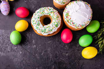 Easter, cake, eggs, holiday. Easter cake and colorful eggs on a dark background. It can be used as a background