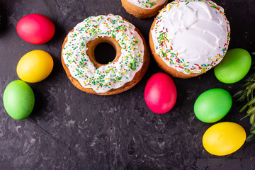 Easter, cake, eggs, holiday. Easter cake and colorful eggs on a dark background. It can be used as a background