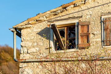 Broken glass of a window in an abandoned house