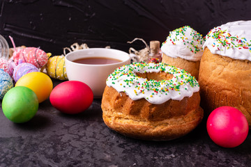 Easter, cake, eggs, holiday. Easter cake and colorful eggs on a dark background. It can be used as a background