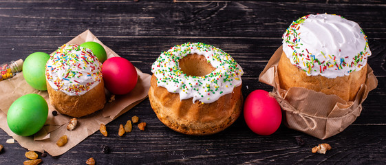 Easter, cake, eggs, holiday. Easter cake and colorful eggs on a dark background. It can be used as a background