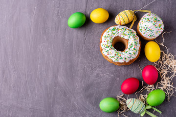 Easter, cake, eggs, holiday. Easter cake and colorful eggs on a dark background. It can be used as a background