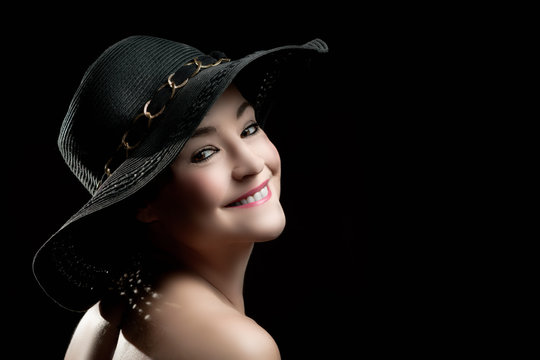 Portrait of attractive elegant sexy woman with black hat - retro style