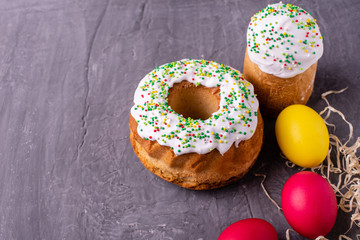 Easter, cake, eggs, holiday. Easter cake and colorful eggs on a dark background. It can be used as a background