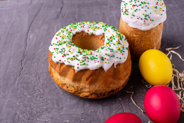 Easter, cake, eggs, holiday. Easter cake and colorful eggs on a dark background. It can be used as a background