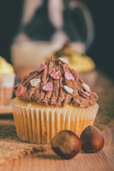 Homemade muffin cupcake with chocolate cream