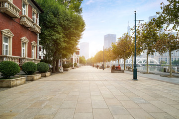Fototapeta premium empty tiled floor and urban skyline,tianjin china