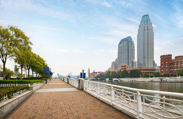 empty tiled floor and urban skyline,tianjin china