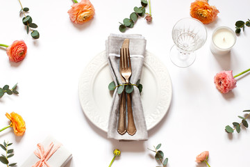 Empty plate concept flat lay with floral decorations on the white backdround. Top view Valentines day, Mothers day or Easter card
