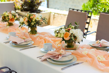 decorated table in the restaurant for a wedding dinner