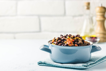 Beef and bean stew in a pot. Selective focus, space for text.
