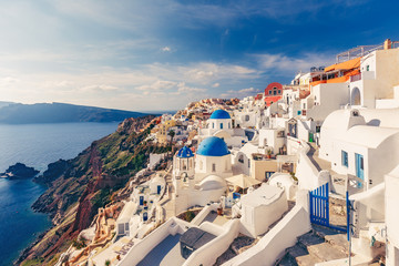 Architecture of Oia village, Santorini island in Greece, on a sunny day with dramatic sky. Scenic...