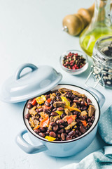 Beef and bean stew in a pot. Selective focus, space for text.