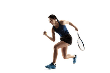 Full length portrait of young woman playing tennis isolated on white background. Healthy lifestyle. The practicing, fitness, sport, exercise concept. The female model in motion or movement