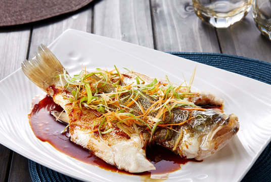 Chinese style marinated steamed fish with Onion and ginger
