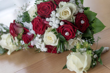 Beautiful bouquet of white and red roses for wedding