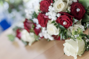 Fototapeta na wymiar Beautiful bouquet of white and red roses for wedding