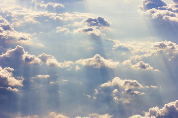 Background blue sky with a cloud behind the airplane window