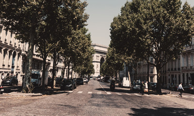 Fototapeta na wymiar Luxury buildings with Arch de Triomphe on the background