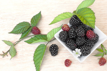 Closeup shot of fresh blackberries fruit (rubus fruticosus) a wooden table.Top view. 