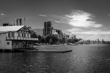 Naklejka premium Perth seen from Elizabeth key including house of West Australian Rowing Club and fire brigade practicing in black and white