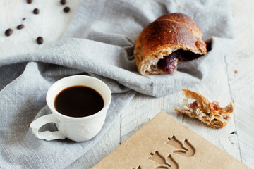 Breakfast with coffee and croissant