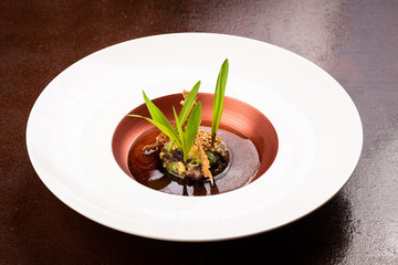 Vegan Fine dining appetizer in a gourmet restaurant, vegetable and beans with sauce