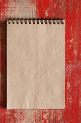 brown blank note book on grunge wood