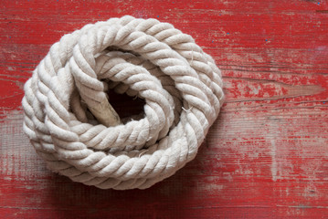 Fototapeta na wymiar ship rope on wooden background
