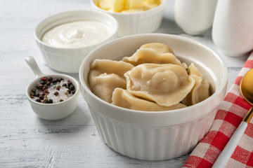 Traditional pelmeni, ravioli, dumplings with meat, close-up.