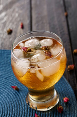Ice flowers tea on wooden table