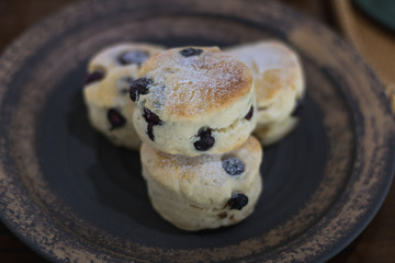 scones on ceramic dish in coffee cafe.