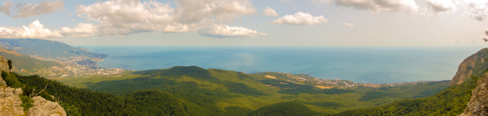 Fototapeta premium View from mount AI-Petri on the Black sea in the Crimea. On the left is the city of Yalta. Panorama of 4 pictures
