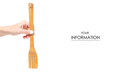 Wooden kitchen fork in a hand pattern on a white background isolation