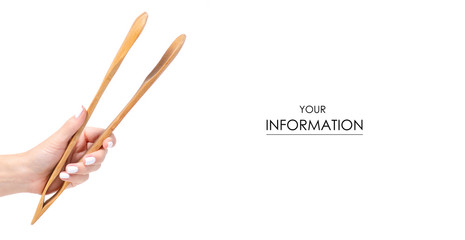 Wooden kitchen tongs in a hand pattern on a white background isolation
