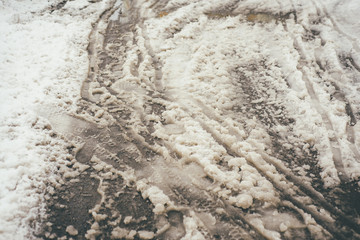 Dirty car tracks on the snow