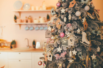 Closeup of cute Christmas tree in kitchen