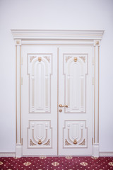 white wooden doors with baguettes