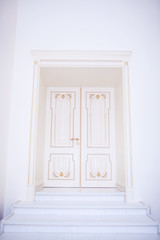 white wooden doors with baguettes