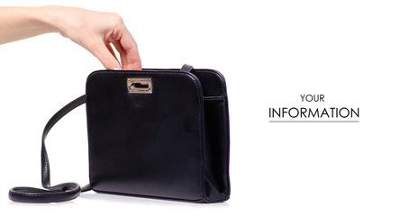 Female black leather bag in hand pattern on white background isolation