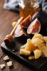 snack in fault with fruit, cheese and honey