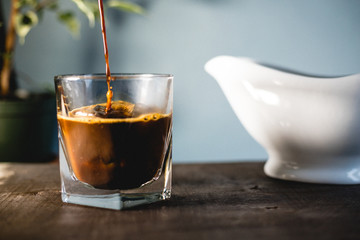 Pouring milk and coffee