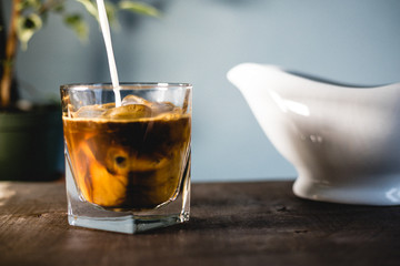 Pouring milk and coffee