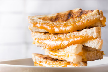 Grilled cheese sandwich on wooden table. Close up