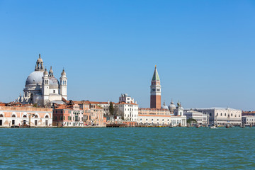 Fototapeta na wymiar Waterfront view of Santa Maria della Salute, San Marco square and Doge's Palace in Venice, Italy
