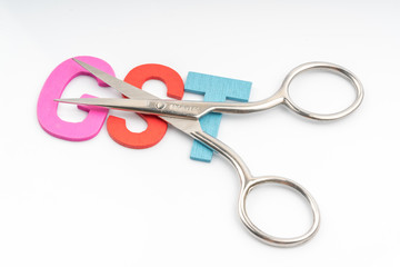 Scissors and the alphabet GST