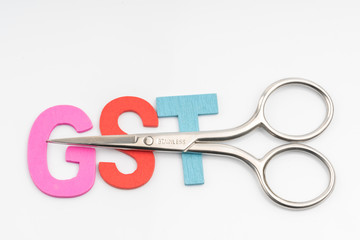 Scissors and the alphabet GST