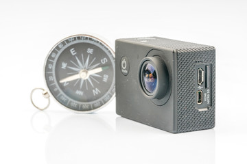 Action camera and compass with travell concept.