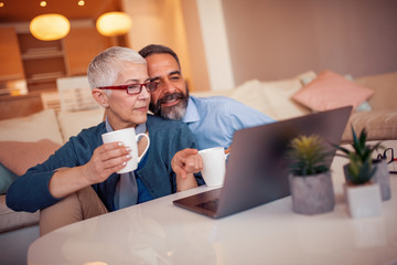Romantic mature couple enjoying at home