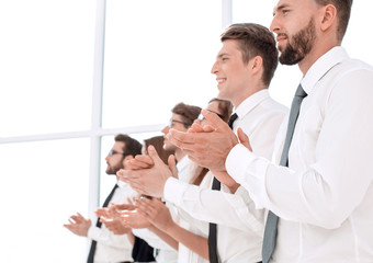 Fototapeta premium close up.smiling business team applauds standing